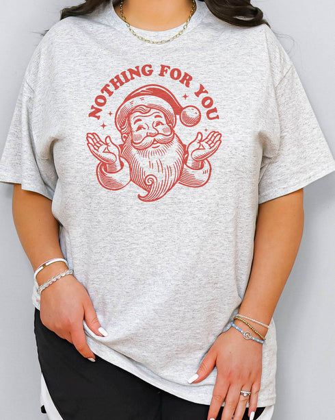 Woman wearing funny retro Santa Clause graphic shirt in ash grey color with the quote "Nothing For You"